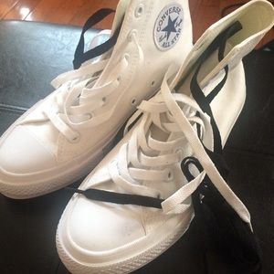 White Converse Chuck Taylor high tops